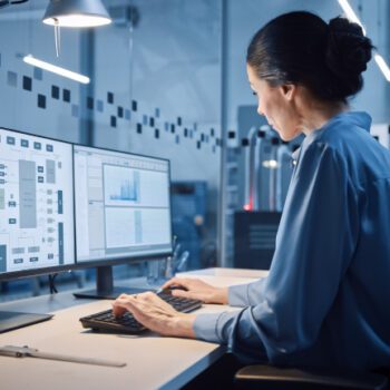 Beautiful and Confident Female Industrial Systems engineer job Working on a list of the best engineering companies to work for.